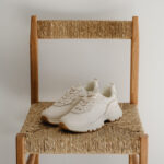 Sneakers on a rattan chair