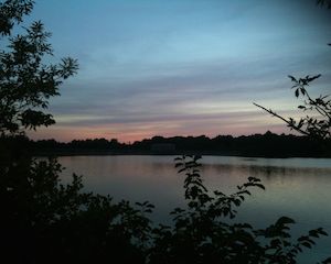 Image of a sunset over a lake, photography by R. Isip 