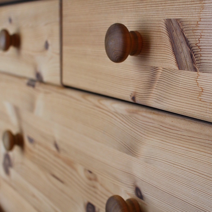 Close up of wooden drawers in a dresser