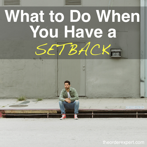 Image of a man sitting on a sidewalk curb and the phrase, What to Do When You Have a Setback