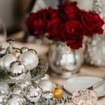 Holiday table place setting with roses and ornaments