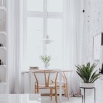 Sunny white room with table and chairs